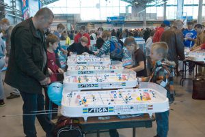 Saint - Petersburg, Russia - September 8, 2012: Children and adults play the table hockey Stiga Play Off. Public campaign I Choose Sport, organized by the Committee for Physical Culture and Sports of the Government of St-Petersburg and Lenexpo.